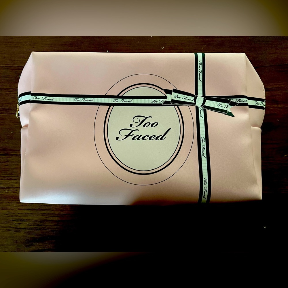 - Too faced makeup bag. Light pink